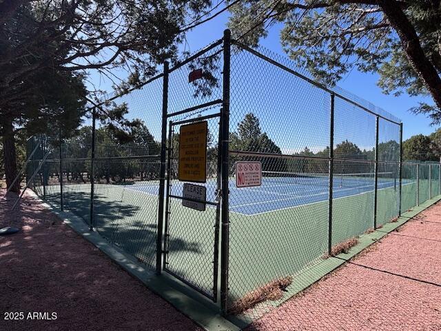 2806 Skyhawk Dr, Overgaard, AZ 85933 - view of tennis court with fence