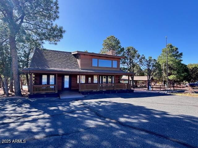 2806 Skyhawk Dr, Overgaard, AZ 85933 - log home with a porch