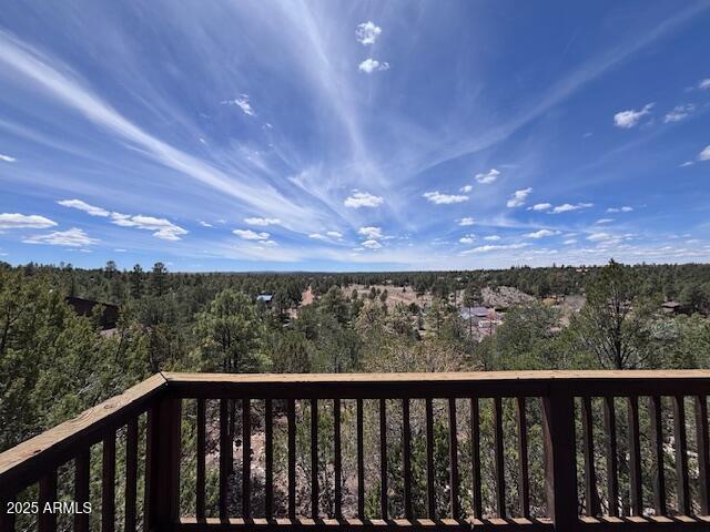 2806 Skyhawk Dr, Overgaard, AZ 85933 - wooden deck featuring a view of trees