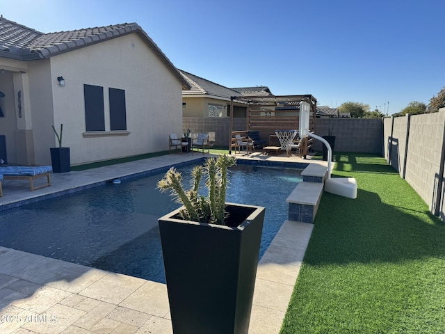 view of pool with a yard, a pergola, and a patio