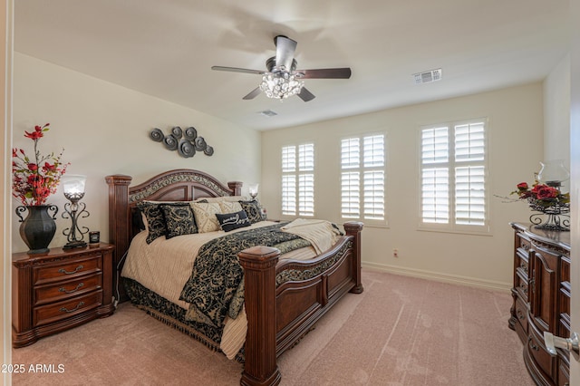 bedroom featuring light colored carpet and ceiling fan