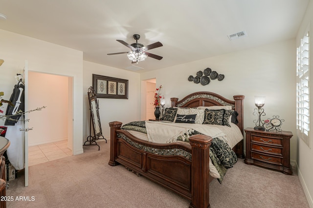 bedroom with light carpet and ceiling fan