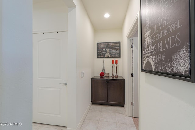 hallway with light tile patterned flooring