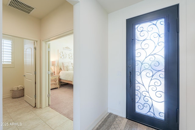 foyer with light carpet