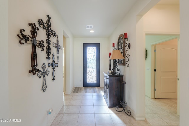 entrance foyer featuring light tile patterned flooring