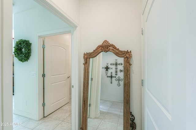 corridor with light tile patterned floors