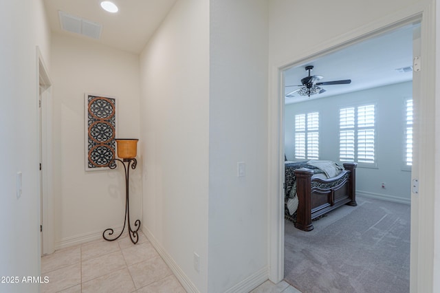 corridor with light colored carpet