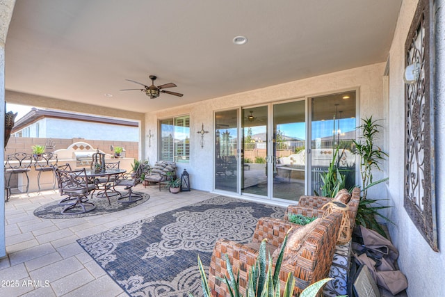 view of patio / terrace featuring ceiling fan