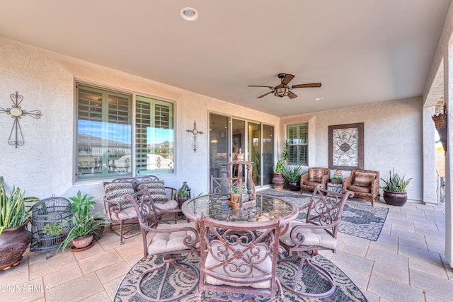 view of patio / terrace featuring ceiling fan