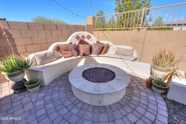 view of patio / terrace featuring an outdoor fire pit