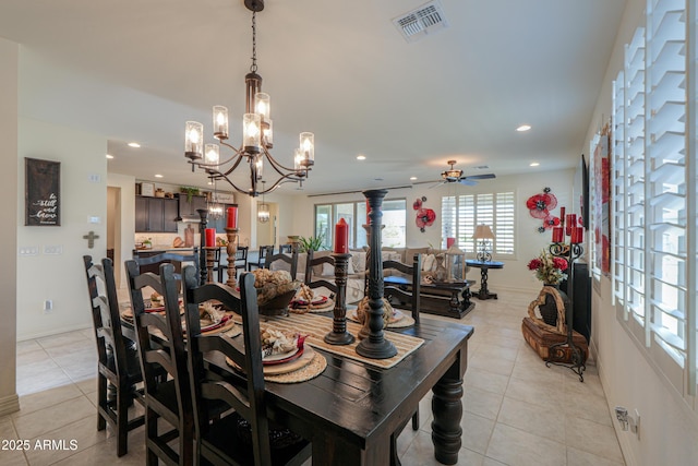 tiled dining area featuring ceiling fan