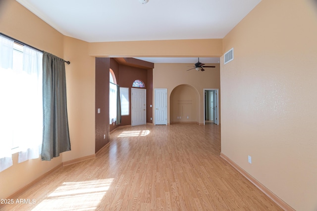 4484 Desert Springs Trl, Sierra Vista, AZ 85635 - spare room featuring arched walkways, light wood-type flooring, baseboards, and a ceiling fan