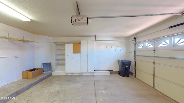 4484 Desert Springs Trl, Sierra Vista, AZ 85635 - garage featuring a garage door opener and baseboards