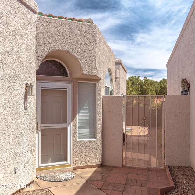 4484 Desert Springs Trl, Sierra Vista, AZ 85635 - property entrance featuring stucco siding and a gate