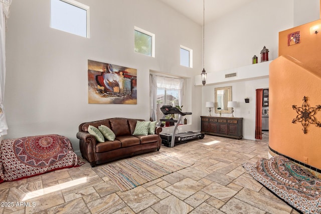 4331 E Redwood Ln, Phoenix, AZ 85048 - living room featuring a high ceiling and stone tile flooring