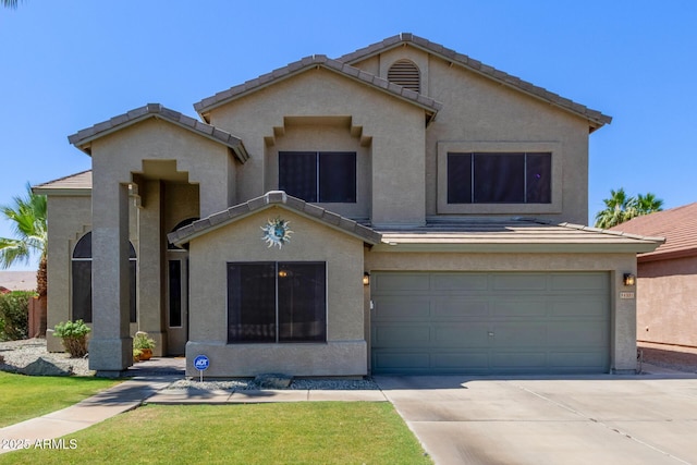 4331 E Redwood Ln, Phoenix, AZ 85048 - view of front of house featuring an attached garage, stucco siding, concrete driveway, a tile roof, and a front lawn