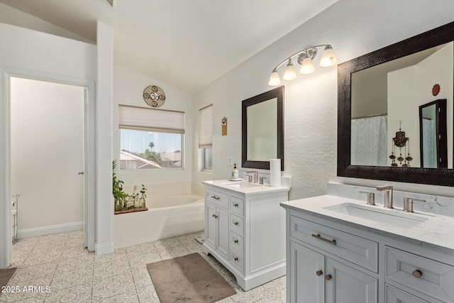 4331 E Redwood Ln, Phoenix, AZ 85048 - full bathroom with vaulted ceiling, two vanities, a bath, and tile patterned floors