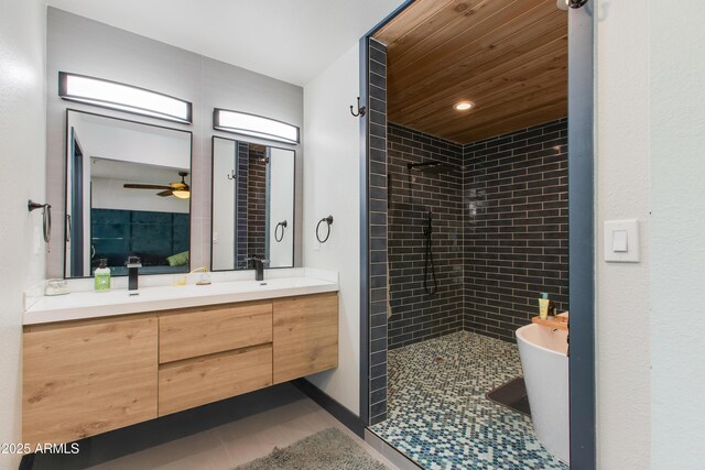 7102 E Kalil Dr, Scottsdale, AZ 85254 - bathroom featuring walk in shower, double vanity, tile patterned floors, a freestanding bath, and recessed lighting