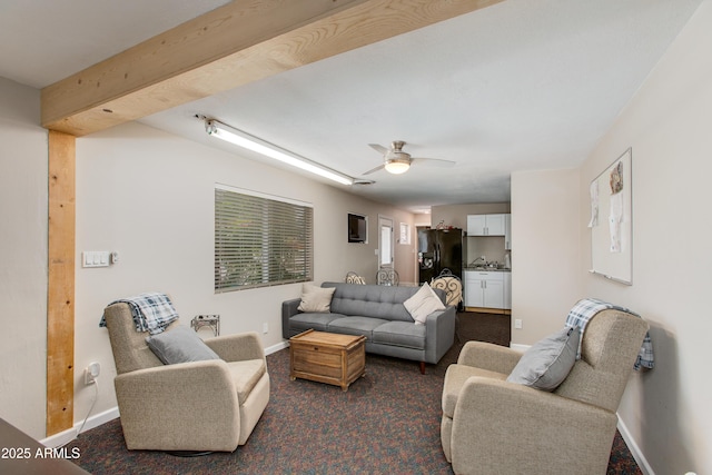 7102 E Kalil Dr, Scottsdale, AZ 85254 - living area with dark colored carpet, baseboards, and a ceiling fan