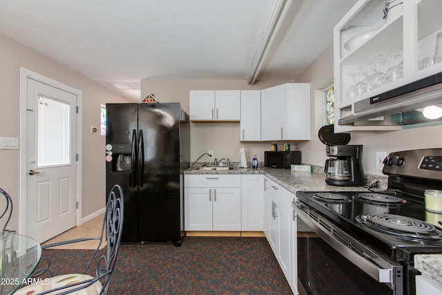 7102 E Kalil Dr, Scottsdale, AZ 85254 - kitchen with black appliances, white cabinets, light stone countertops, and a sink