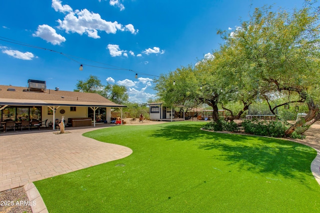 7102 E Kalil Dr, Scottsdale, AZ 85254 - view of grassy yard featuring a patio area and central air condition unit