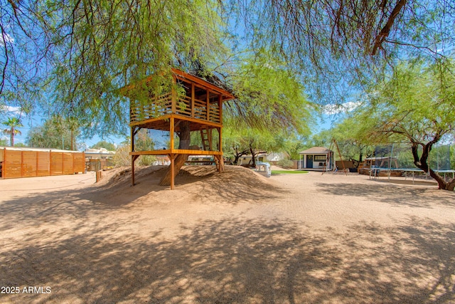 7102 E Kalil Dr, Scottsdale, AZ 85254 - view of yard featuring a trampoline