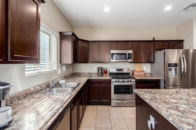 kitchen featuring light tile patterned floors, recessed lighting, visible vents, appliances with stainless steel finishes, and a sink