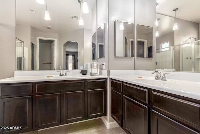 bathroom with tile patterned flooring, visible vents, and vanity