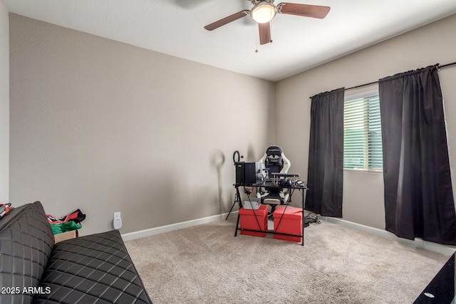 misc room with ceiling fan, carpet, and baseboards