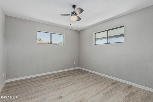 4441 N 27th Dr, Phoenix, AZ 85017 - unfurnished room with healthy amount of natural light, wood finished floors, baseboards, and ceiling fan