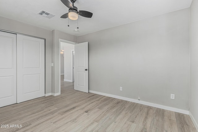 4441 N 27th Dr, Phoenix, AZ 85017 - unfurnished bedroom featuring baseboards, light wood-style floors, a closet, and ceiling fan