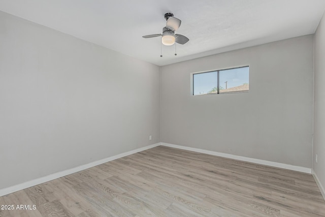 4441 N 27th Dr, Phoenix, AZ 85017 - empty room featuring wood finished floors, baseboards, and ceiling fan