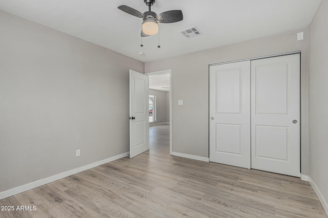 4441 N 27th Dr, Phoenix, AZ 85017 - unfurnished bedroom with light wood-type flooring, baseboards, a closet, and ceiling fan