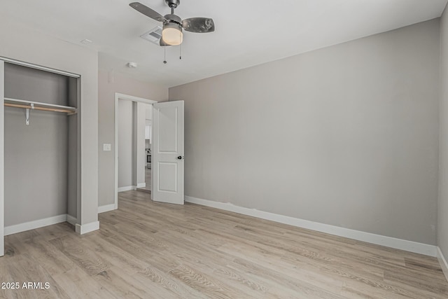 4441 N 27th Dr, Phoenix, AZ 85017 - unfurnished bedroom with light wood-type flooring, a closet, baseboards, and ceiling fan