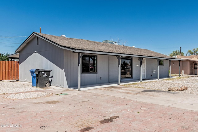 4441 N 27th Dr, Phoenix, AZ 85017 - back of property featuring roof with shingles and fence