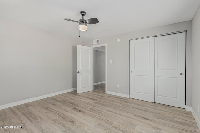 4441 N 27th Dr, Phoenix, AZ 85017 - unfurnished bedroom featuring light wood-type flooring, baseboards, a closet, and a ceiling fan