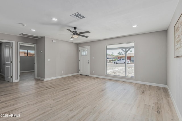 4441 N 27th Dr, Phoenix, AZ 85017 - unfurnished living room featuring light wood-style flooring, baseboards, recessed lighting, and ceiling fan