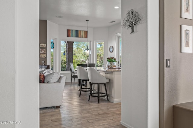 dining area with light hardwood / wood-style flooring