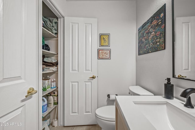 bathroom with vanity and toilet