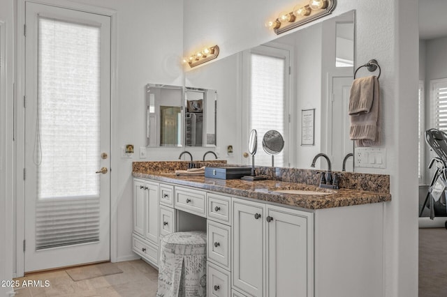 bathroom with a healthy amount of sunlight and vanity