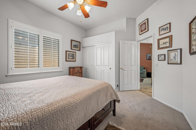 bedroom with light colored carpet, a closet, and ceiling fan