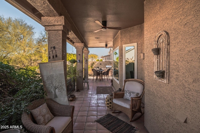 view of patio / terrace featuring ceiling fan