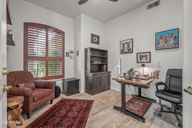 home office featuring ceiling fan and light wood-type flooring