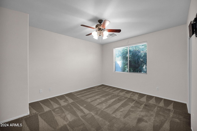 carpeted empty room with ceiling fan