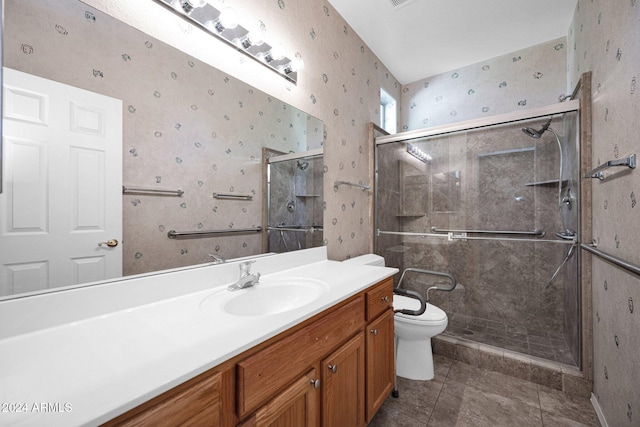 bathroom with toilet, walk in shower, vanity, and tile patterned floors