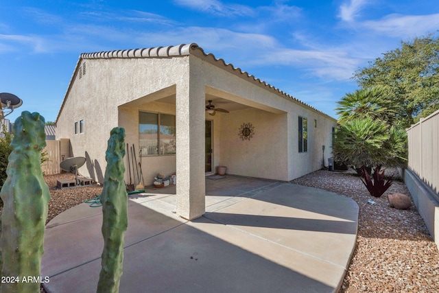 back of house with a patio and ceiling fan