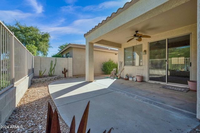 view of patio featuring ceiling fan