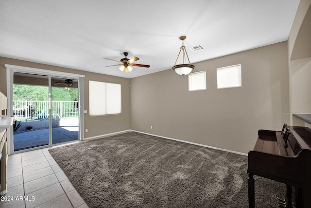 living room featuring ceiling fan and light carpet