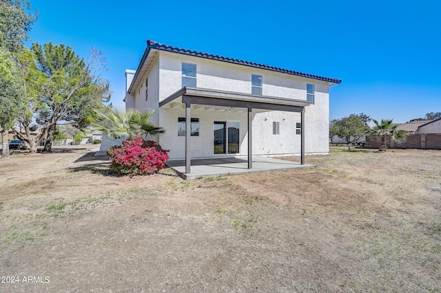 back of property with a patio area