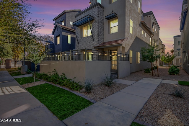 view of property exterior at dusk